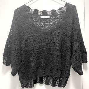 A very stylish black knitted blouse, like new!
